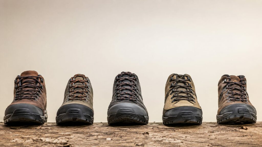 Hiking boots displayed from above showing varied toebox widths and shapes